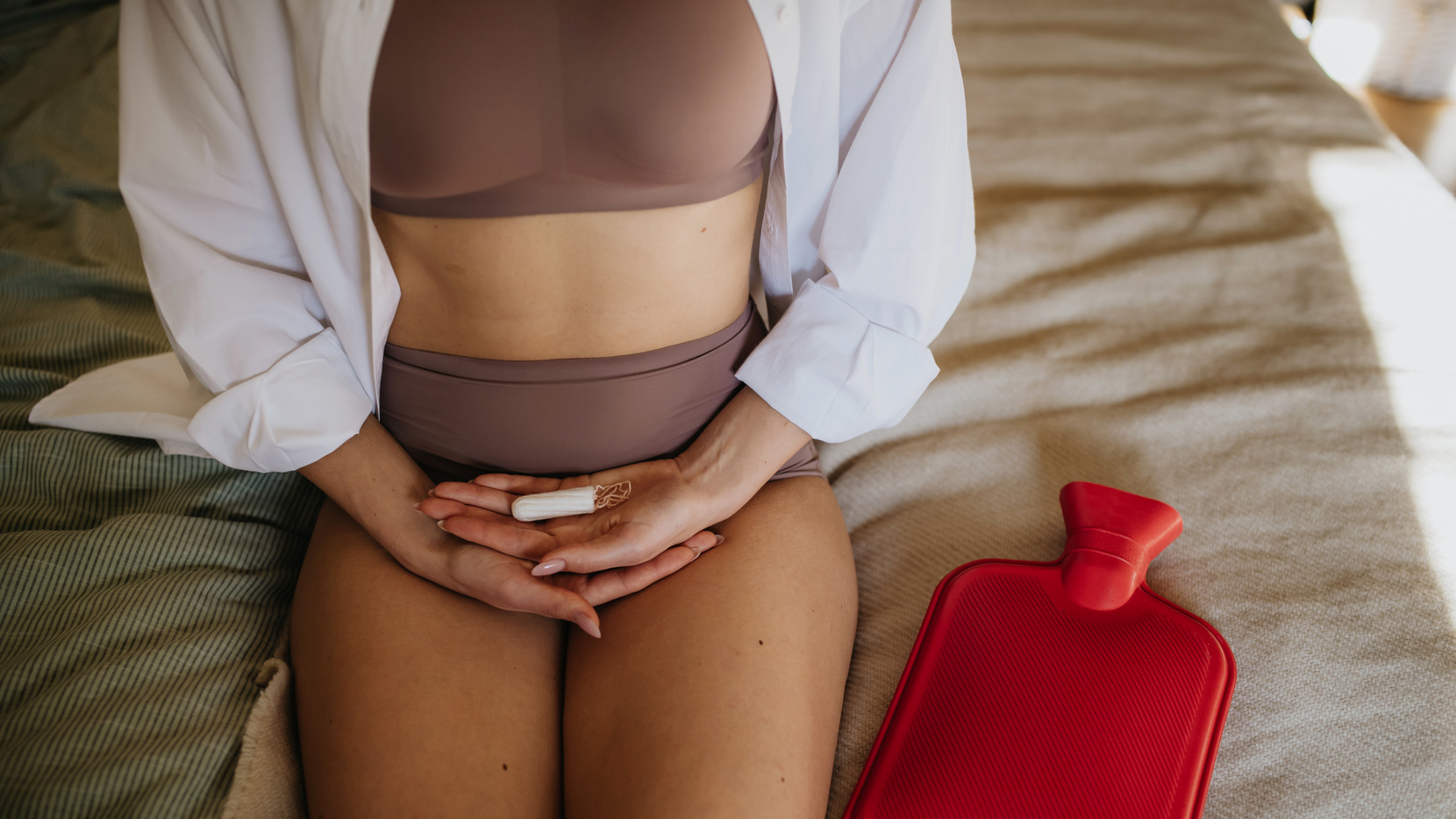 Woman Holding Menstrual Hygiene Products, Period Supplies. Menstrual Cup and Tampon in Palms, Close up.